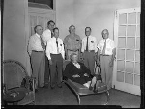 Primary view of object titled '[Seven Men Posing in Room]'.