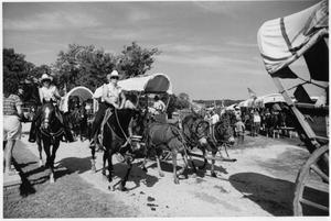 Primary view of object titled 'Texas Sesquicentennial Wagon Train on the Way from Gainesville to Whitesboro'.