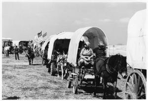 Primary view of object titled 'Texas Sesquicentennial Wagon Train on the Way to Robstown'.