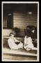 Photograph: [Frances Marion Allen and Sheila Emery Allen with dog on porch at 190…