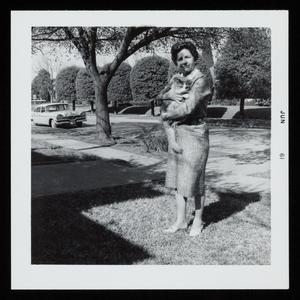 Primary view of object titled '[Sheila Emery Allen standing outside with kitty]'.