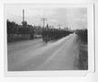 Photograph: [Servicemen Marching Down a Road]