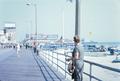 Photograph: [Woman looking out at a Pier]