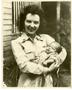 Photograph: [Helena Teresa Llic Holding Baby Amerensin Boloogapo]