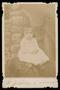 Thumbnail image of item number 1 in: '[Portrait of an Unknown Child Sitting on Straw]'.