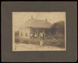 Primary view of [Portrait of an Unknown Family on a Porch]