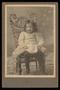 Primary view of [Portrait of a Child on a Wicker Chair]