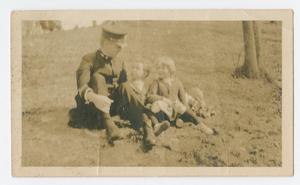 Primary view of object titled '[Commander Chester W. Nimitz Sits with His Children]'.