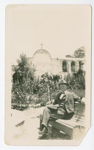 Primary view of object titled '[Chester W. Nimitz Sits on Bench]'.