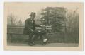 Photograph: [Chester W. Nimitz Sits on Bench with Child]