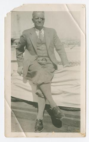 Primary view of object titled '[Chester W. Nimitz Sits with Legs Crossed]'.