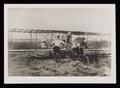 Photograph: [John Pliska, Gray Coggin, and Their Biplane]
