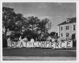 Primary view of [Students with Homecoming banner, 1941]