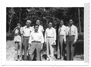 Primary view of object titled '[Group of Hispanic Men Standing in a Forest]'.