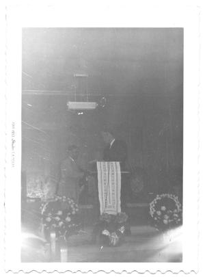 Primary view of object titled '[Two Men Standing at a Podium]'.