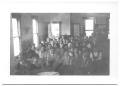 Photograph: [Large Congregation Sitting in Church Pews]
