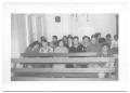 Photograph: [Congregation of Hispanic People Sitting in the Pews of a Church]
