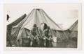 Photograph: [Soldiers Sit in Flooded Camp]