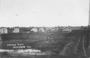 Primary view of object titled '[Indiana Town in Rosenberg, a horse-drawn buggy is on the right.]'.