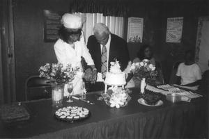 Primary view of object titled 'Cutting a Wedding Cake at First Baptist Church'.