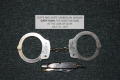 Photograph: [Image of Arlington Police Officer Gary Harl's handcuffs and pocket k…