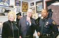 Primary view of [APD Chaplain Elliott, his wife, and Chief Bowman at the grand reopening of the museum at the Arlington Training Center]