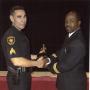 Photograph: [Arlington Police Officer Bob Cowsert receiving Officer of the Year A…