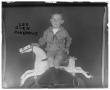 Photograph: [Portrait of Boy on Rocking Horse]