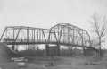 Postcard: [Brazos River bridge in Rosenberg. The river is dry under the bridge.]