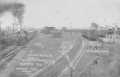 Primary view of [Railroad Yard in Rosenberg, train approaching to the left]