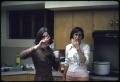 Thumbnail image of item number 1 in: '[Two Women Stand in a Kitchen at a Library Party]'.