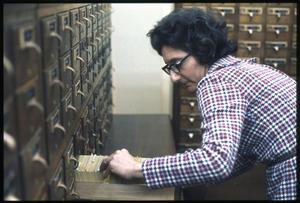 Primary view of object titled '[Carolyn Simon Searches the Card Catalog]'.