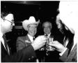 Photograph: [Jim Wright toasting with Martin Frost and others]