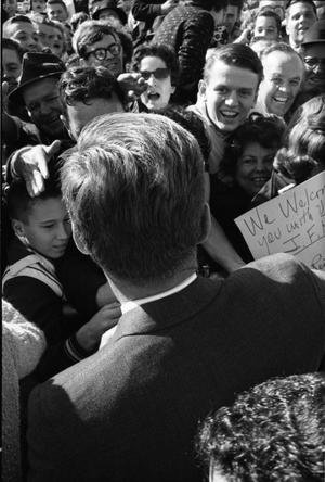 Primary view of object titled '[President Kennedy greets the crowd at Dallas Love Field Airport]'.