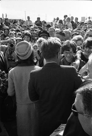 Primary view of object titled '[The Kennedys make their way through the crowd at Dallas Love Field]'.