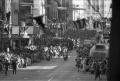 Photograph: [Presidential motorcade on Main Street in downtown Dallas]