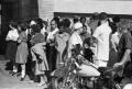 Photograph: [People outside Parkland Hospital awaiting news of President Kennedy]