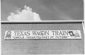 Photograph: Texas Sesquicentennial Wagon Train Headquarters Sign in Irving