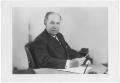 Photograph: [Portrait of R. L. Blaffer seated at desk]