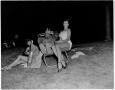 Photograph: [Two women with Cactus Pryor on a lounge chair]