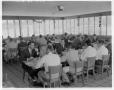 Photograph: [Men seated at dining tables at the University School of Law]