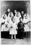 Photograph: [School children dressed in WWI Red Cross and Army uniforms]