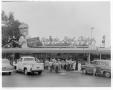 Photograph: [Customers and parked cars in front of Kentucky Fried Chicken stand]
