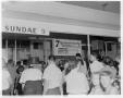 Photograph: [Customers in front of Kentucky Fried Chicken stand]