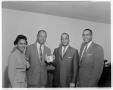 Photograph: [Woman and three men posing for picture]