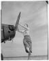 Photograph: Unidentified Woman Starting a Plane