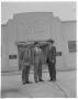 Photograph: [Men standing in front of Carpenter Paper Company building]