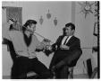 Photograph: [Guy Williams and Buddy Van Horn playfully fighting with swords]