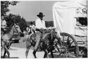Primary view of object titled 'Texas Sesquicentennial Wagon Train on Its Way from Gainesville to Whitesboro'.