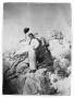 Photograph: Man on Rock With Hat